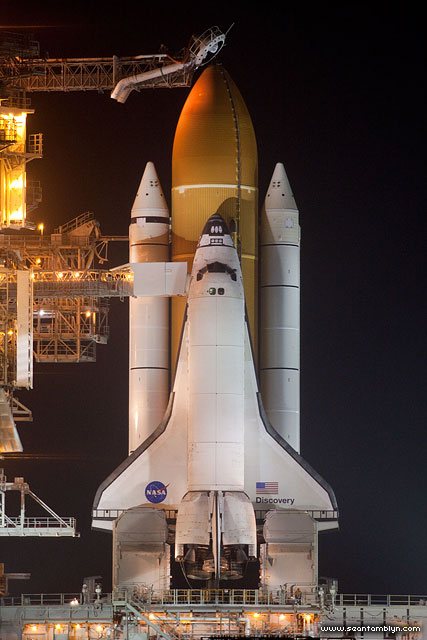 STS-133 space shuttle Discovery on the launch pad after RSS rollback